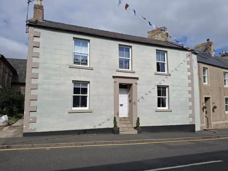 A Georgian-fronted townhouse cleaned up and made good — heritage frontages get treated gently.