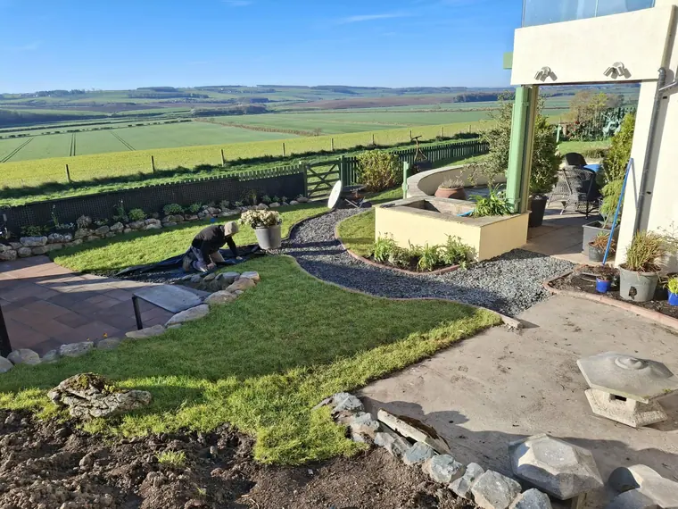 The completed scheme from the top of the garden, laid out to work with the slope instead of against it.