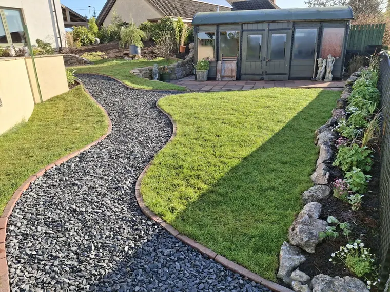 Finished lawn, path and beds, with the sun room reinstated as the centre of the garden.