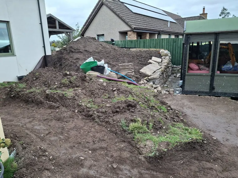 Spoil heaped and levels cut back to the sun room, working around a live household the whole time.