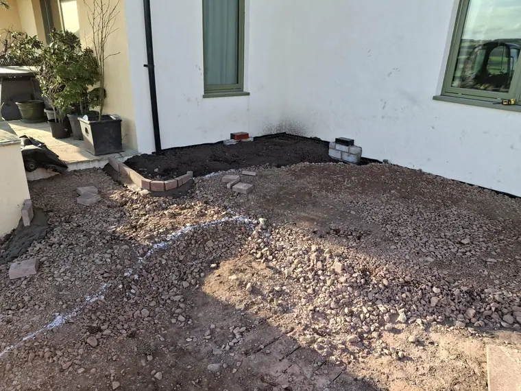 Terrace area dug out and edged in block, waiting on hardcore before the paving goes down.
