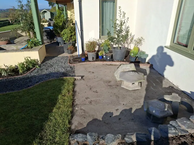 Base prepared and edged, with slate margin already run so the paving lands into a finished edge.