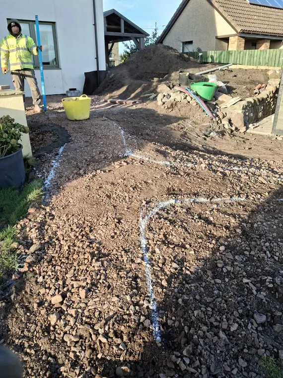 Sub-base compacted and the path line chalked in, ready for edgings and membrane.